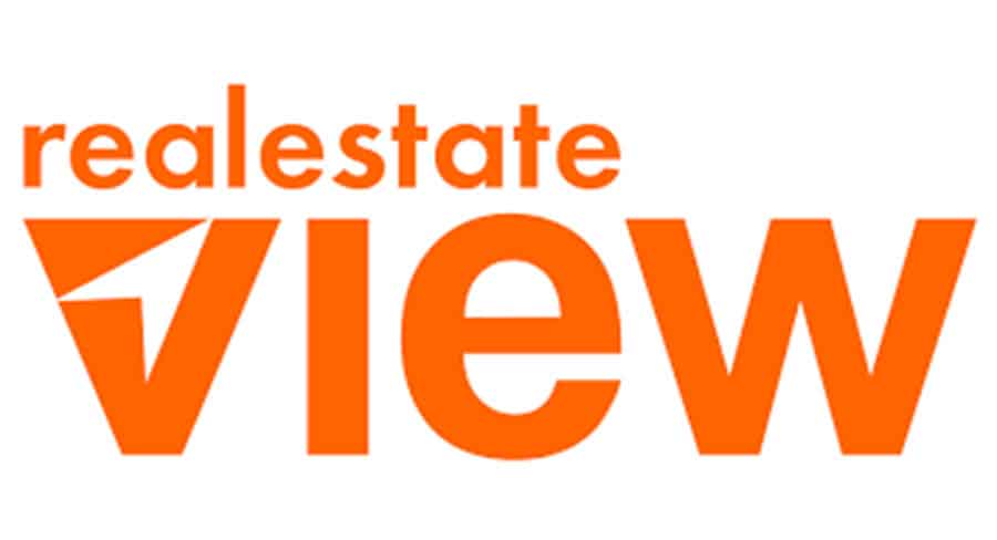 realestateVIEW logo in bold orange text with a stylised “V” symbol.