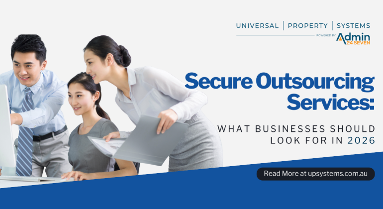 Business professionals reviewing work together, representing secure outsourcing services by Universal Property Systems for 2026.